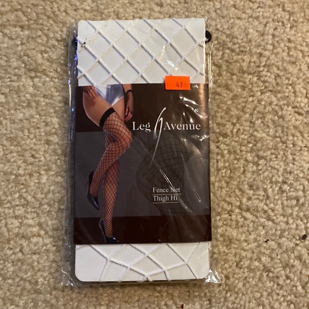 Brand new. White fishnet thigh highs